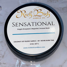 Load image into Gallery viewer, Rich Bish Candle Co's "Sensational" luxury coconut soy wax blend hand poured candle in sleek black metal tin with lid. Masculine scented with the top fragrance notes of bergamot, magnolia, and sensual musk. Eco-friendly, vegan candles